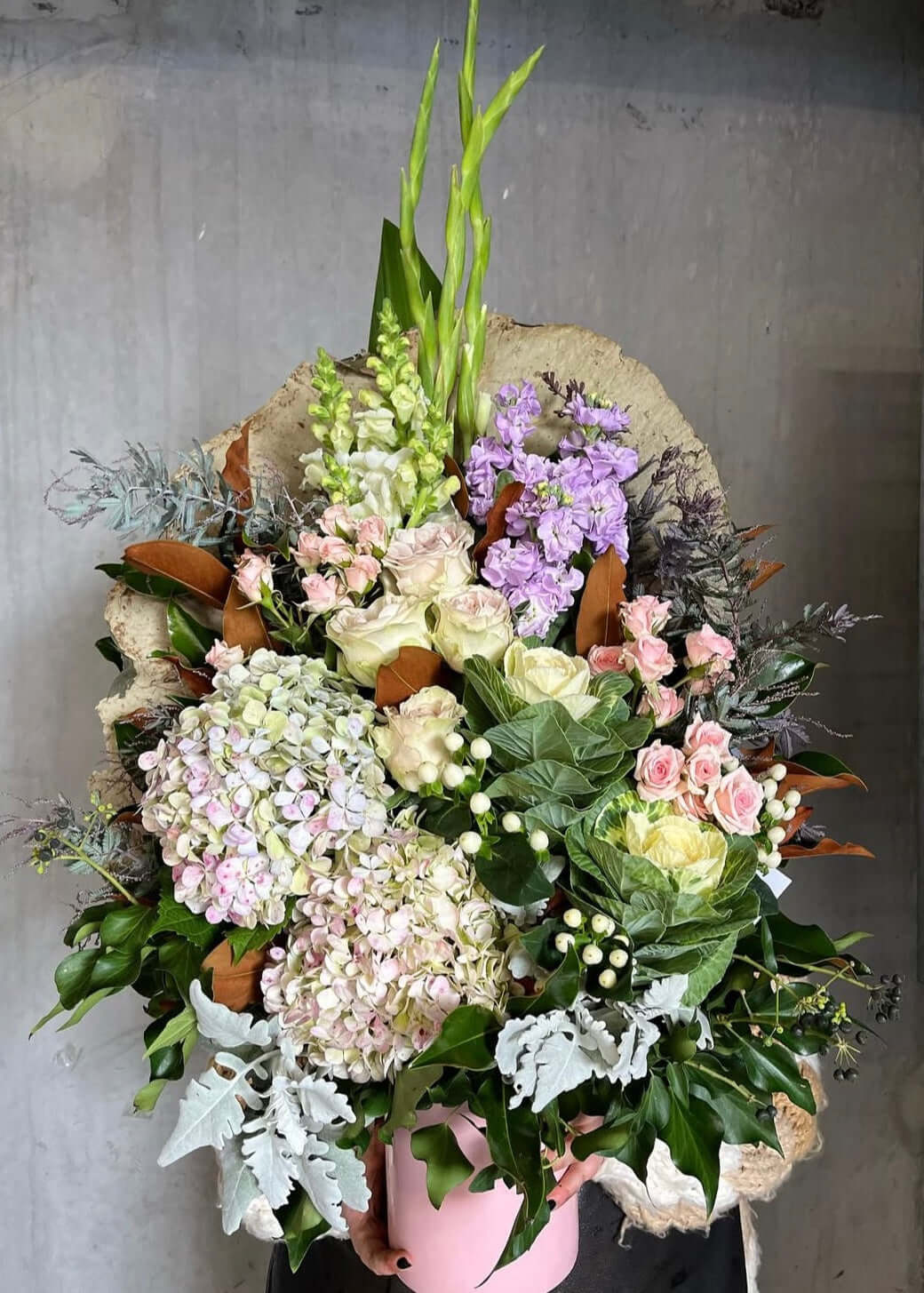 Dream In Pastels bouquet by Sassy Stems with vibrant flowers and leafy greens, perfect for flower delivery and same day delivery.