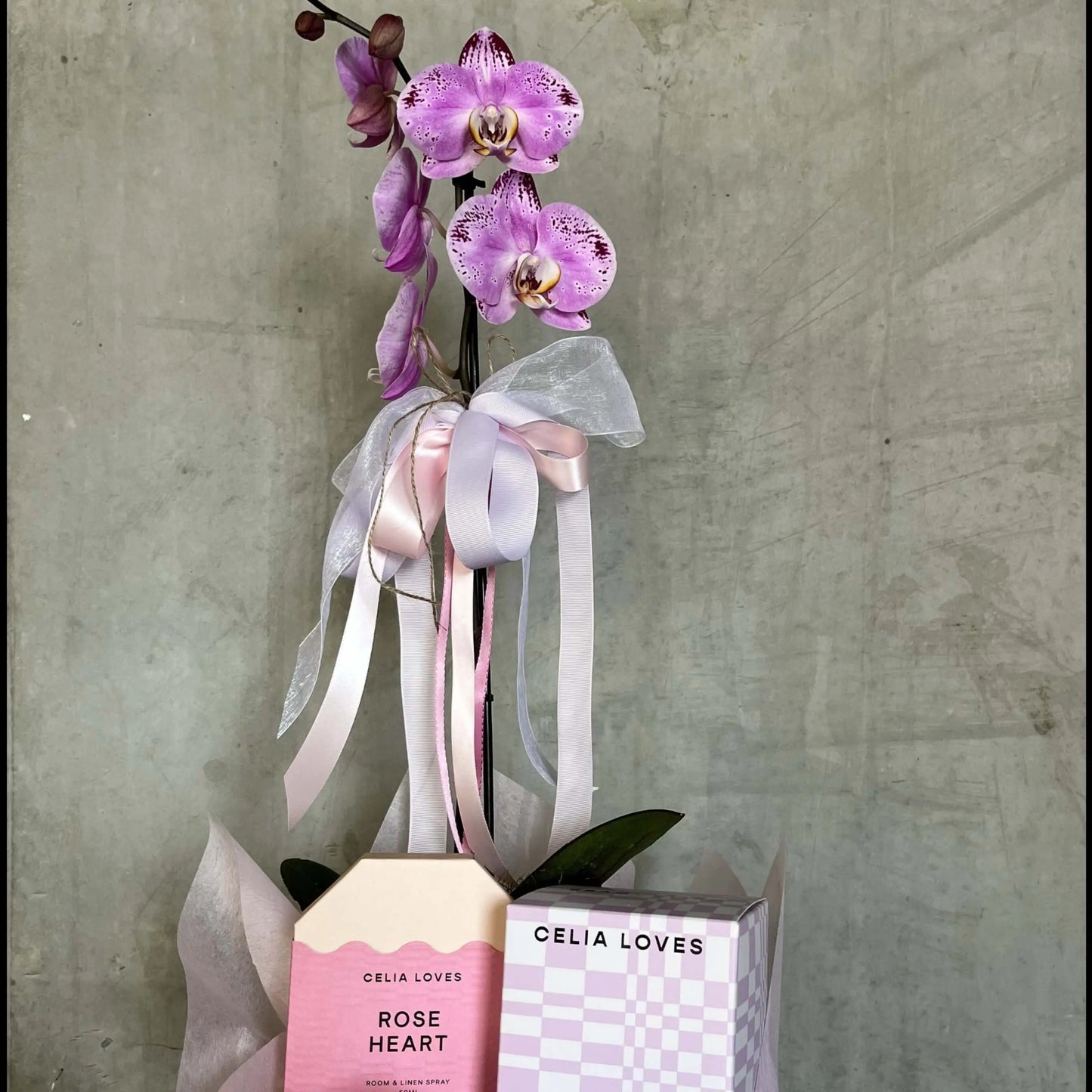 Beautiful flower arrangement with pink orchid and decorative packaging for Mother's Day | Florist near me.