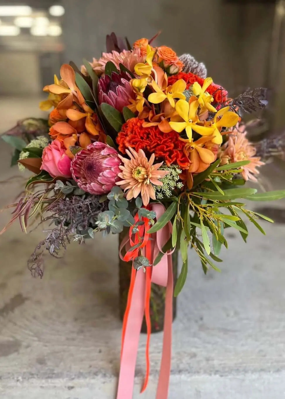 rustic flower arrangements featuring vibrant blooms in a beautiful bouquet with colorful ribbons from Rusty But Cute in Berwick.