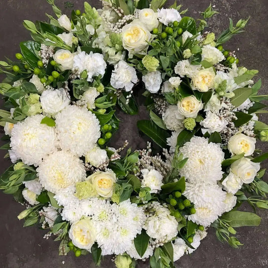 Funeral flower arrangement for funeral flower etiquette Berwick, featuring white roses and chrysanthemums.