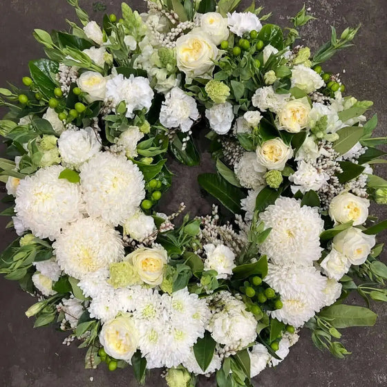 Funeral flower arrangement for funeral flower etiquette Berwick, featuring white roses and chrysanthemums.