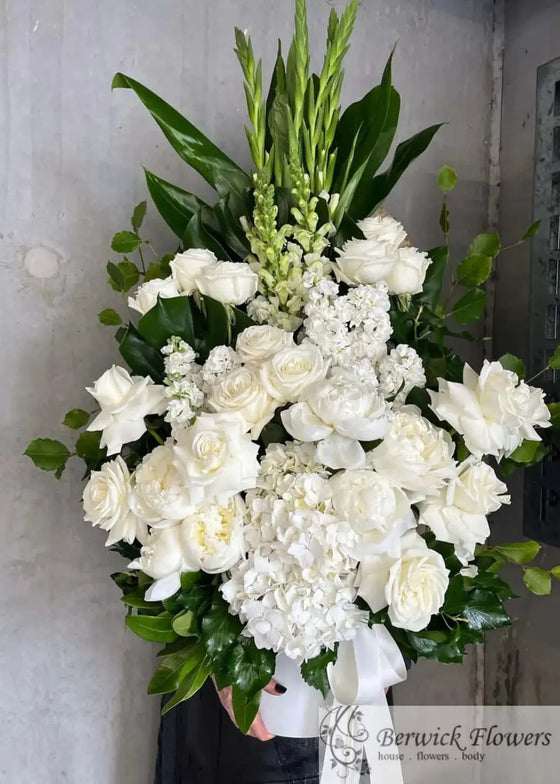 Classic White Standing Sympathy Arrangement: Funeral Flowers with Timeless Grace Berwick Flowers