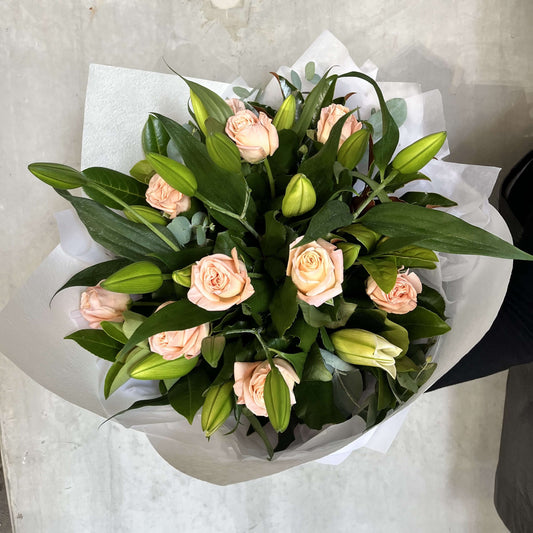 Beautiful bouquet featuring pink roses and green lilies for Mother's Day flower delivery by Wonder Mum.