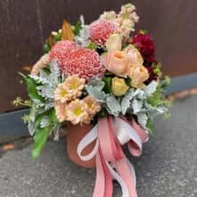 Beautiful Mother's Day flower delivery Berwick bouquet with pink and orange blooms and ribbon decoration.